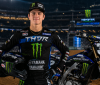 Haiden Deegan standing in front of his Yamaha dirt bike in full motocross riding kit